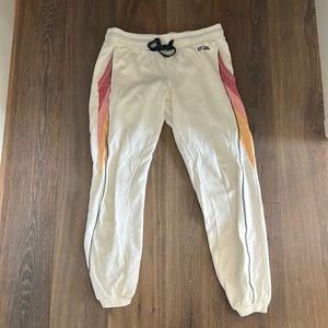 Rip curl size medium white with pink and yellow on the side sweat pants